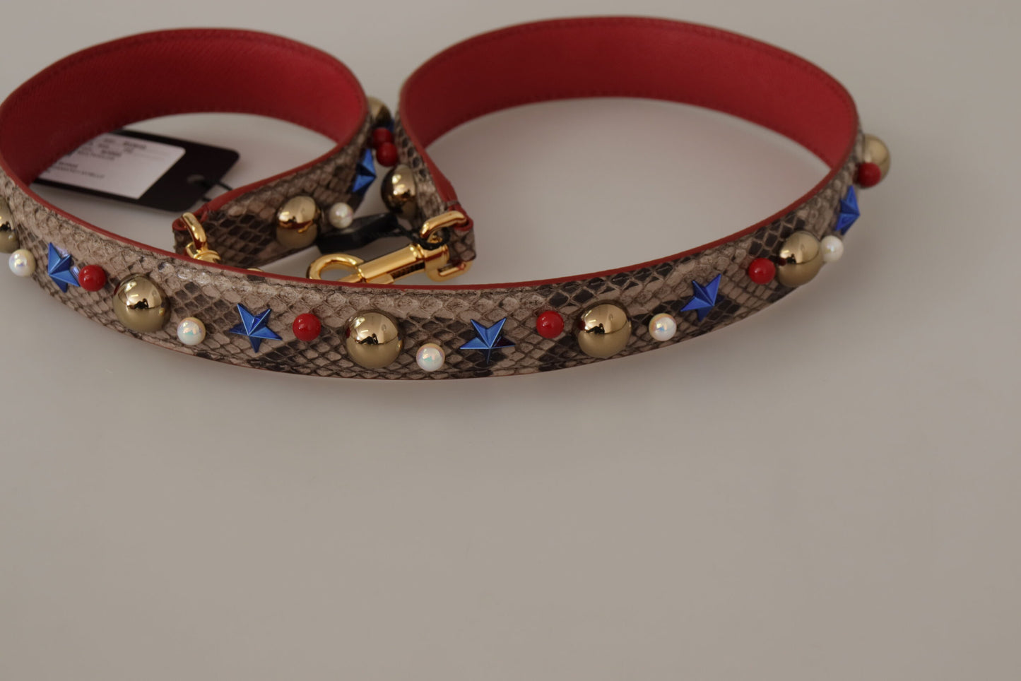 حزام كتف من الجلد المصنوع من جلد الأفعى البني من Dolce & Gabbana مزين بالدبابيس.
