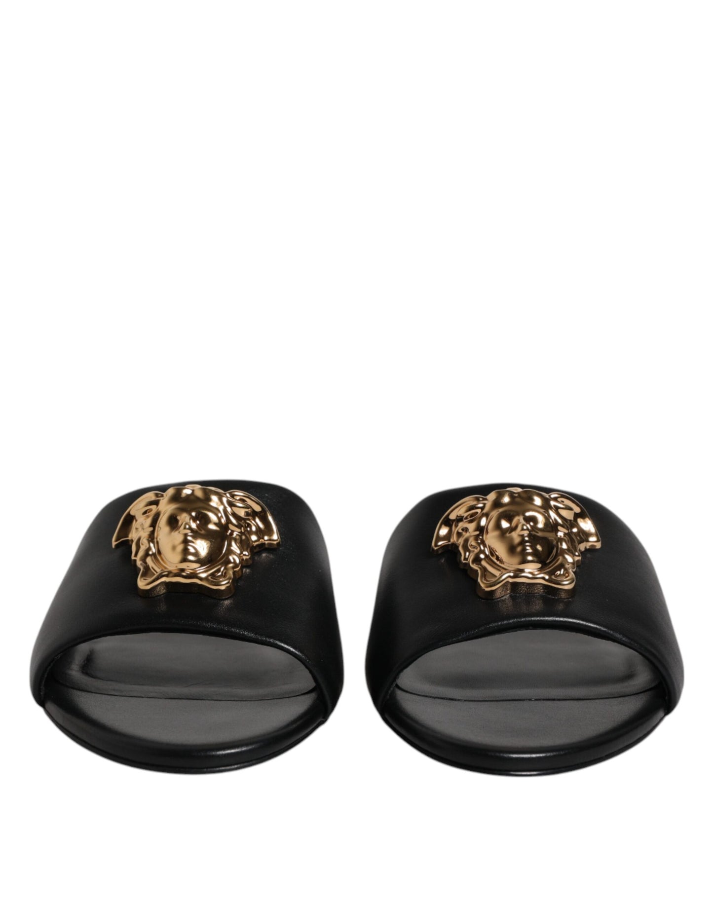 Claquettes plates à enfiler en cuir noir avec plaque logo Versace
