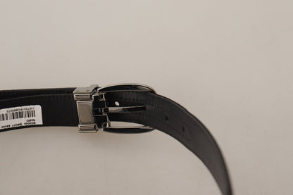 Ceinture en cuir de veau noir avec boucle en métal argenté et logo de la marque Dolce &amp; Gabbana.