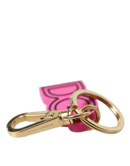 Porte-clés Dolce &amp; Gabbana en caoutchouc rose et métal doré avec logo DG