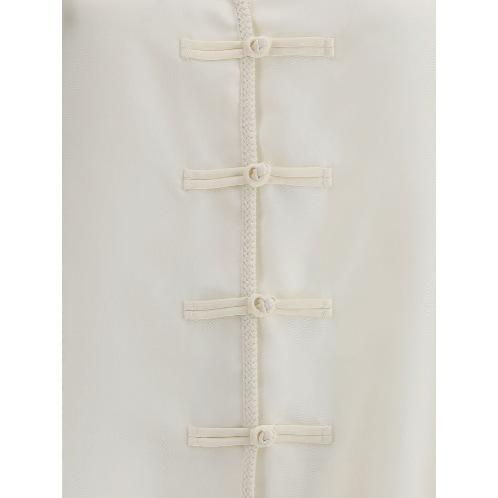Polo Courrèges avec détail torsadé