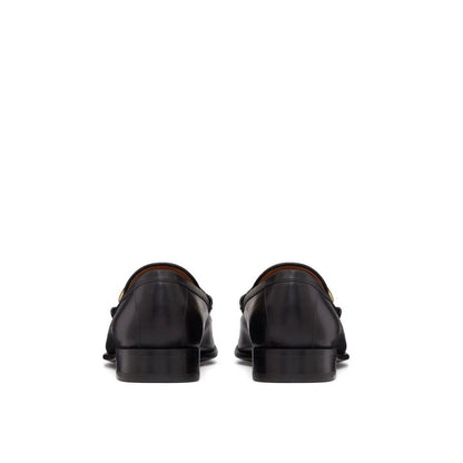 Valentino Garavani – Mondförmige Leder-Loafer mit V-Logo