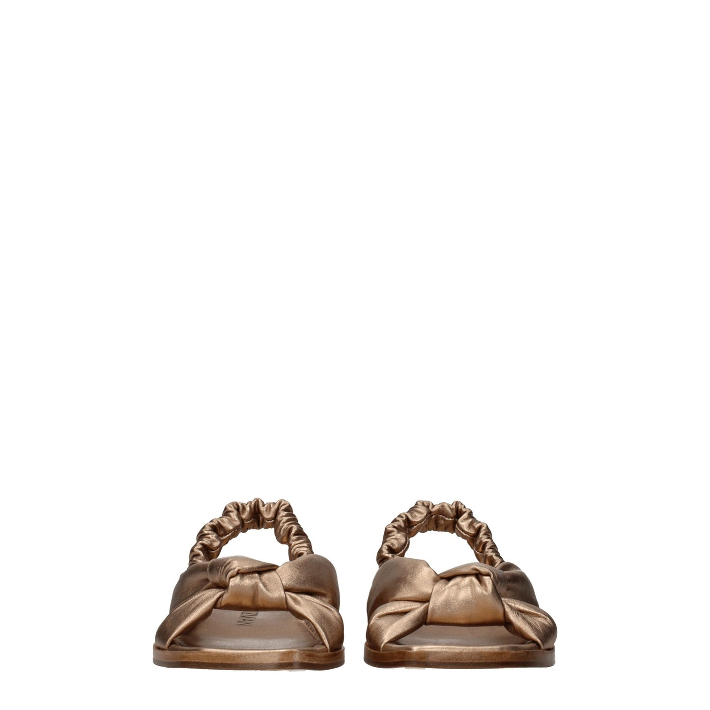 Stuart Weitzman – Flache Sandalen aus goldenem Leder